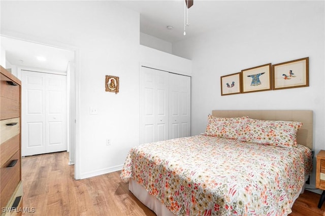 4945 Cougar Ct S Unit 4-202, Naples, FL 34109 - bedroom with wood finished floors, a closet, and a ceiling fan