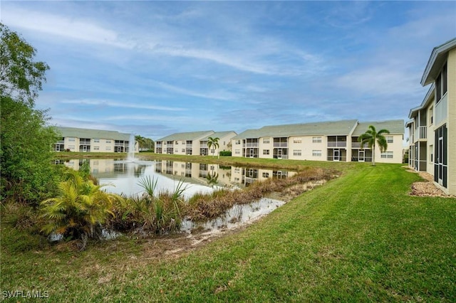 4945 Cougar Ct S Unit 4-202, Naples, FL 34109 - view of home's community featuring a water view, a yard, and a residential view