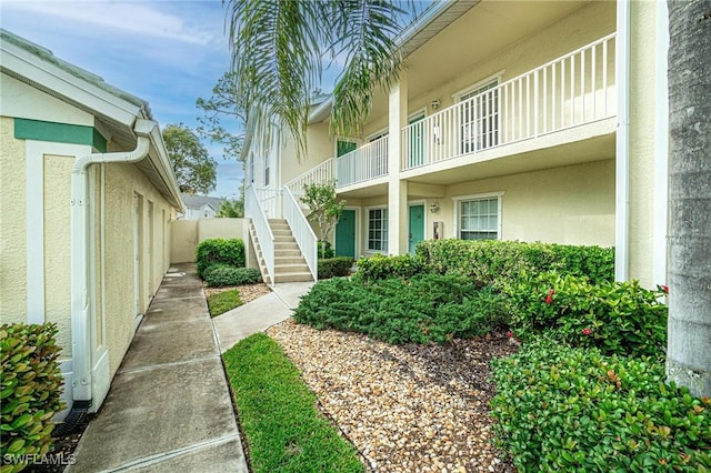 4945 Cougar Ct S Unit 4-202, Naples, FL 34109 - view of yard featuring stairway
