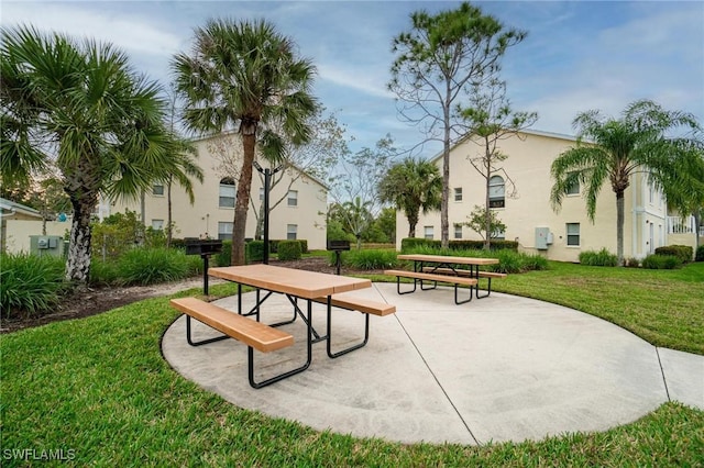 4945 Cougar Ct S Unit 4-202, Naples, FL 34109 - view of community with a lawn