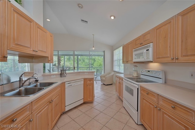 26962 Montego Pointe Ct Unit 202, Bonita Springs, FL 34134 - kitchen featuring white appliances, healthy amount of natural light, lofted ceiling, light countertops, and light tile patterned floors
