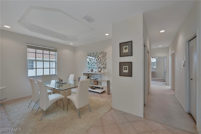 26962 Montego Pointe Ct Unit 202, Bonita Springs, FL 34134 - dining area with recessed lighting, light tile patterned floors, a tray ceiling, and light colored carpet