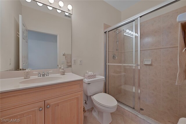 26962 Montego Pointe Ct Unit 202, Bonita Springs, FL 34134 - full bathroom with vanity, a stall shower, and tile patterned floors
