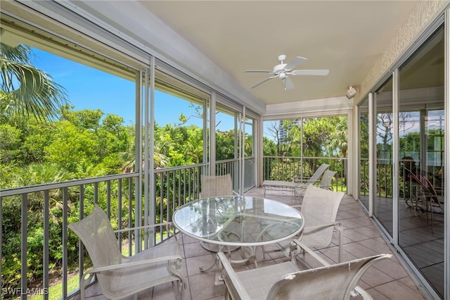 26962 Montego Pointe Ct Unit 202, Bonita Springs, FL 34134 - sunroom / solarium featuring a ceiling fan, outdoor dining space, and view of wooded area