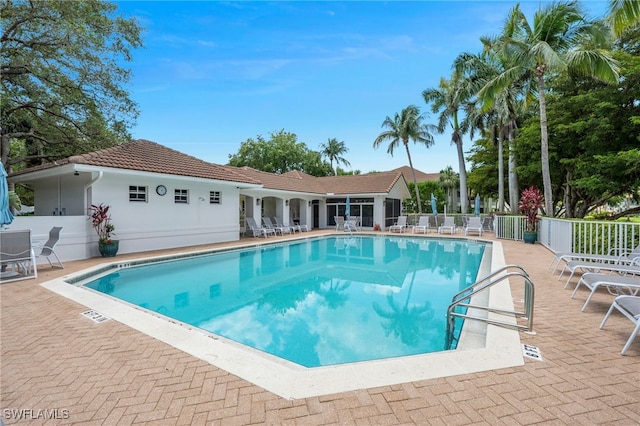 26962 Montego Pointe Ct Unit 202, Bonita Springs, FL 34134 - community pool with a patio area