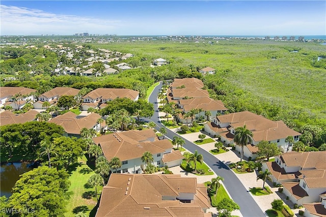26962 Montego Pointe Ct Unit 202, Bonita Springs, FL 34134 - aerial view of property and surrounding area featuring nearby suburban area and a large body of water