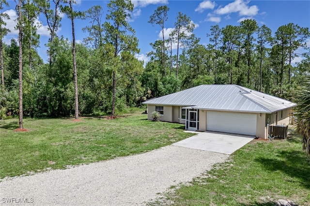 3191 Golden Gate Blvd E, Naples, FL 34120 - view of front of home with gravel driveway, stucco siding, a front lawn, and an attached garage