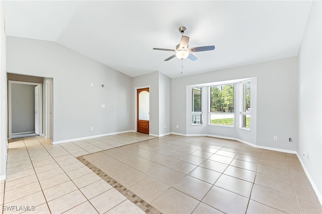 3191 Golden Gate Blvd E, Naples, FL 34120 - unfurnished room featuring light tile patterned floors, ceiling fan, and vaulted ceiling