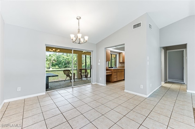 3191 Golden Gate Blvd E, Naples, FL 34120 - spare room with lofted ceiling, a chandelier, and light tile patterned flooring