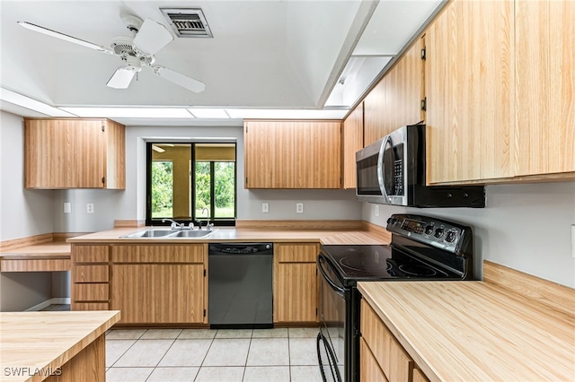 3191 Golden Gate Blvd E, Naples, FL 34120 - kitchen with black range with electric stovetop, dishwasher, stainless steel microwave, light tile patterned floors, and a ceiling fan