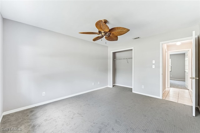 3191 Golden Gate Blvd E, Naples, FL 34120 - unfurnished bedroom featuring carpet, a closet, and ceiling fan