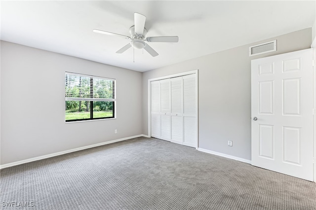 3191 Golden Gate Blvd E, Naples, FL 34120 - unfurnished bedroom with carpet flooring, a closet, and ceiling fan