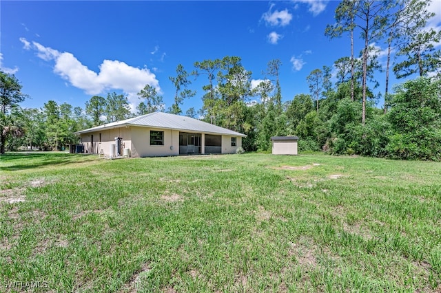 3191 Golden Gate Blvd E, Naples, FL 34120 - view of grassy yard with a storage unit