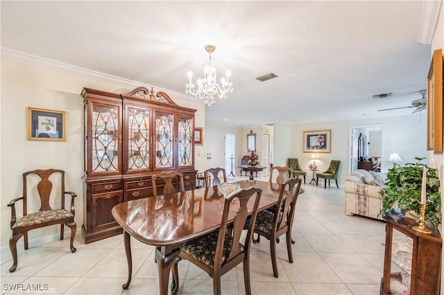 1021 Charlemagne Blvd, Naples, FL 34112 - dining area with light tile patterned flooring, a chandelier, and ornamental molding