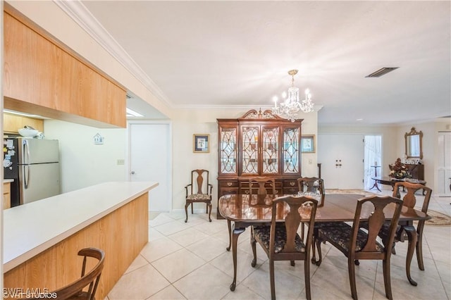1021 Charlemagne Blvd, Naples, FL 34112 - dining area featuring crown molding, light tile patterned flooring, and a chandelier