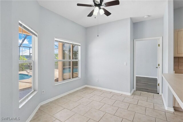 1023 SE 6th St, Cape Coral, FL 33990 - unfurnished room with ceiling fan, a smoke detector, and light tile patterned floors