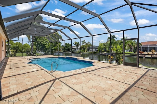 1023 SE 6th St, Cape Coral, FL 33990 - swimming pool featuring a patio area, a water view, and a lanai