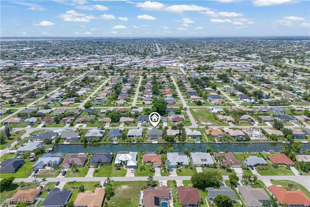 1023 SE 6th St, Cape Coral, FL 33990 - aerial view of property and surrounding area with nearby suburban area and a nearby body of water