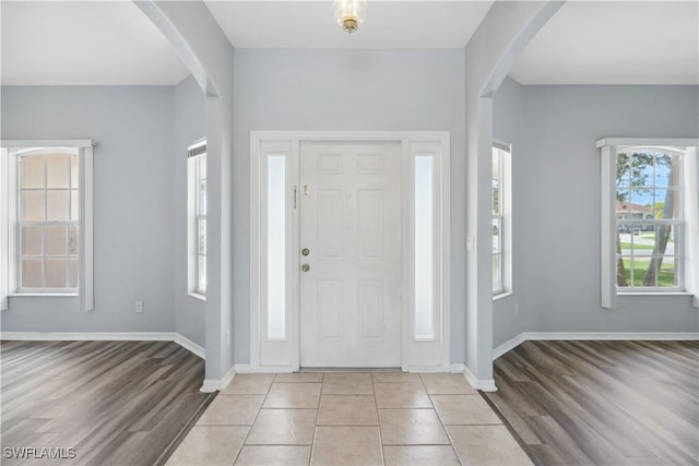 1023 SE 6th St, Cape Coral, FL 33990 - entryway featuring arched walkways and light wood-type flooring
