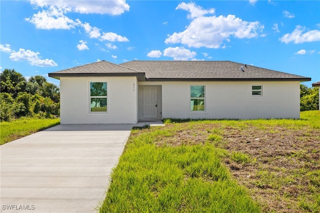 311 Lancelot Ave, Lehigh Acres, FL 33974 - ranch-style house featuring stucco siding and a shingled roof