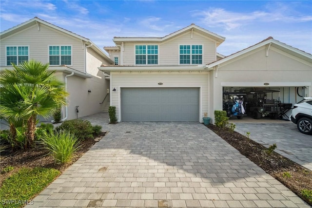15887 Grassland Ln Unit 4622, Punta Gorda, FL 33982 - view of front facade featuring decorative driveway and an attached garage