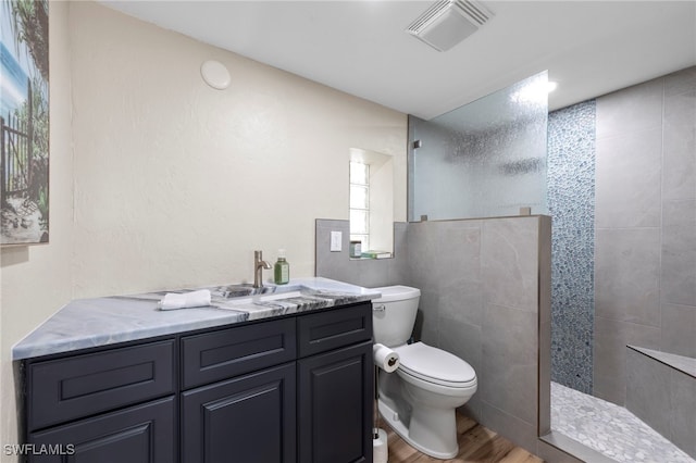 4938 Vincennes St Unit 3, Cape Coral, FL 33904 - bathroom featuring wood finished floors, a walk in shower, and vanity