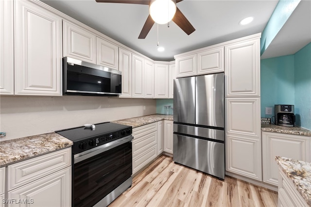 4938 Vincennes St Unit 3, Cape Coral, FL 33904 - kitchen with appliances with stainless steel finishes, light wood-type flooring, white cabinetry, ceiling fan, and recessed lighting