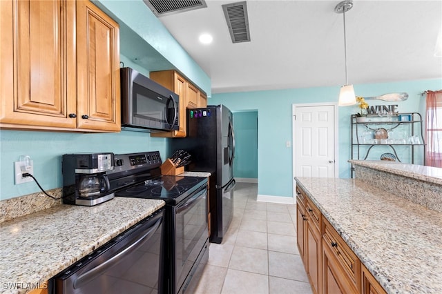 4938 Vincennes St Unit 3, Cape Coral, FL 33904 - kitchen with black range with electric cooktop, dishwashing machine, light stone counters, pendant lighting, and light tile patterned floors