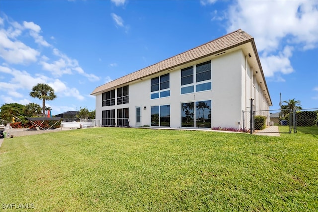 4938 Vincennes St Unit 3, Cape Coral, FL 33904 - back of house featuring stucco siding and roof with shingles