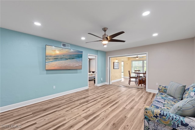 4938 Vincennes St Unit 3, Cape Coral, FL 33904 - living room featuring ceiling fan, wood finished floors, and recessed lighting