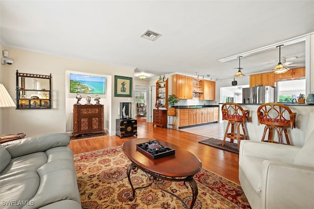 165 4th St, Bonita Springs, FL 34134 - living room with light wood-style floors