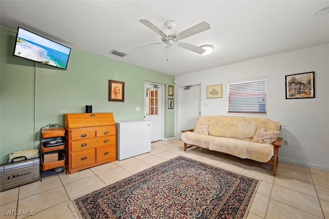 165 4th St, Bonita Springs, FL 34134 - living area featuring light tile patterned flooring and a ceiling fan