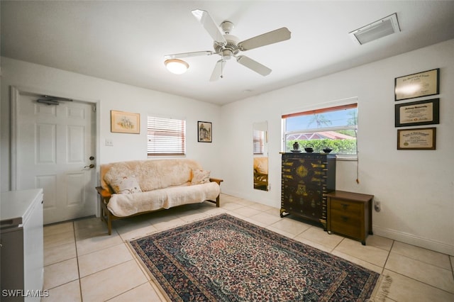 165 4th St, Bonita Springs, FL 34134 - living room with healthy amount of natural light and light tile patterned floors