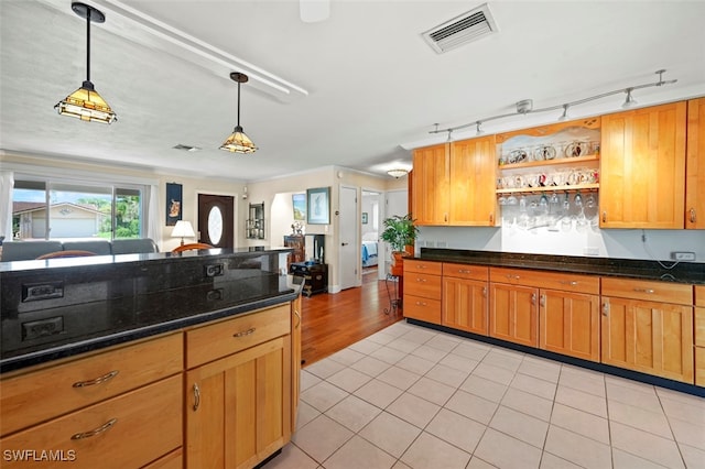 165 4th St, Bonita Springs, FL 34134 - kitchen with pendant lighting, open shelves, light tile patterned floors, rail lighting, and dark stone counters