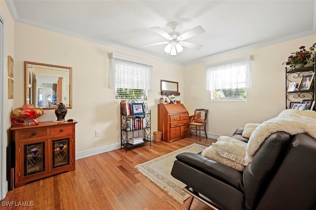 165 4th St, Bonita Springs, FL 34134 - sitting room with light wood-style flooring, crown molding, and ceiling fan