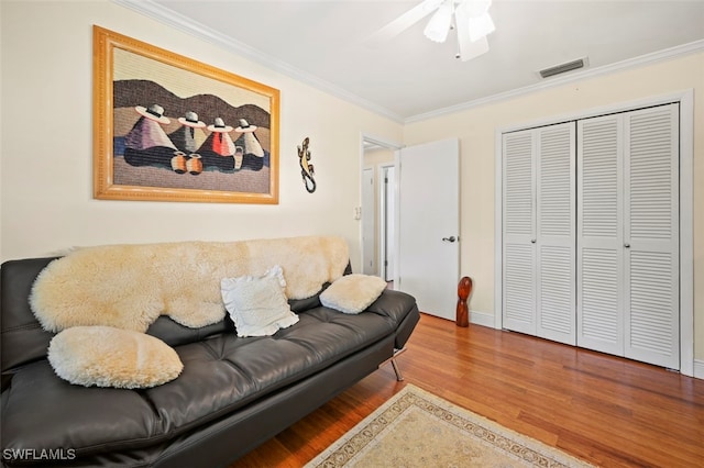 165 4th St, Bonita Springs, FL 34134 - living area featuring crown molding, wood finished floors, and a ceiling fan