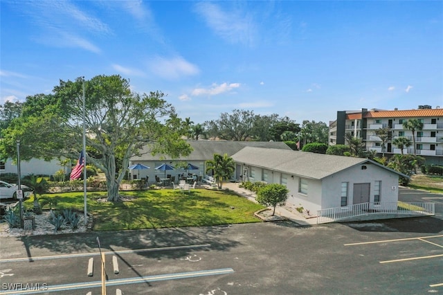 165 4th St, Bonita Springs, FL 34134 - view of property featuring uncovered parking