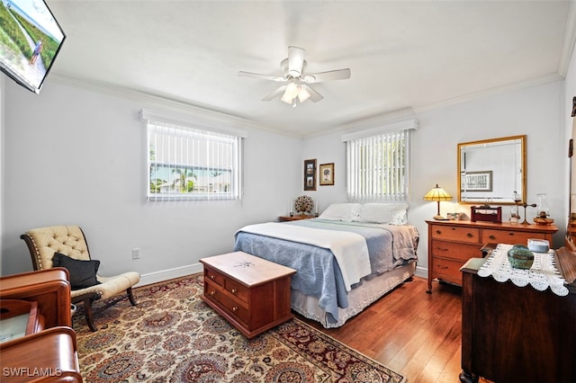 165 4th St, Bonita Springs, FL 34134 - bedroom featuring crown molding, wood finished floors, and a ceiling fan