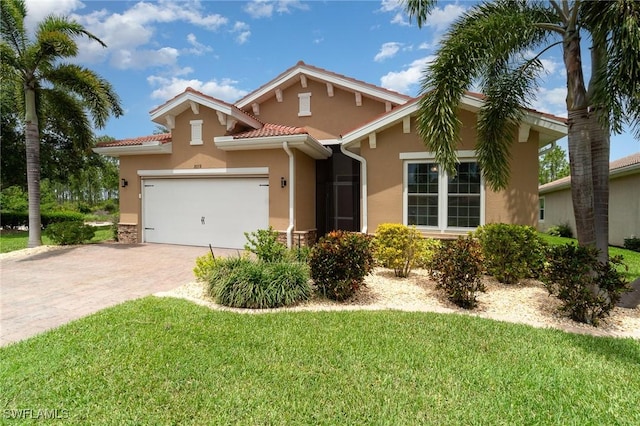 20551 Long Pond Rd, North Fort Myers, FL 33917 - mediterranean / spanish home with stucco siding, an attached garage, a front lawn, decorative driveway, and a tile roof