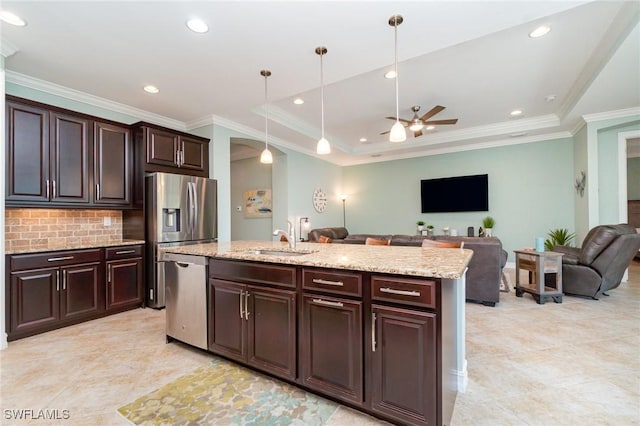 20551 Long Pond Rd, North Fort Myers, FL 33917 - kitchen with stainless steel appliances, a ceiling fan, open floor plan, backsplash, and hanging light fixtures