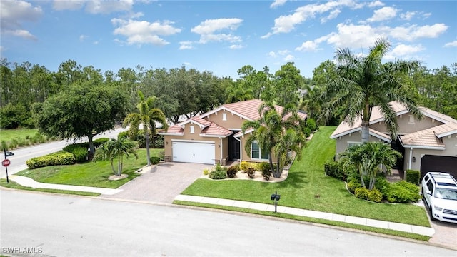 20551 Long Pond Rd, North Fort Myers, FL 33917 - view of front of house with stucco siding, an attached garage, driveway, a front yard, and a tile roof