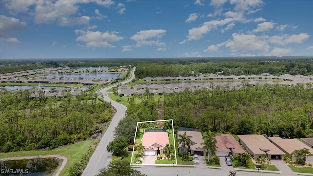 20551 Long Pond Rd, North Fort Myers, FL 33917 - aerial view of residential area with property boundaries highlighted and a large body of water
