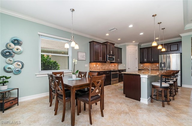 20551 Long Pond Rd, North Fort Myers, FL 33917 - dining room with ornamental molding, recessed lighting, and light tile patterned flooring