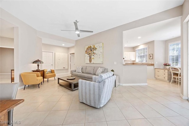 24400 Reserve Ct Unit 103, Bonita Springs, FL 34134 - living area featuring ceiling fan and light tile patterned floors