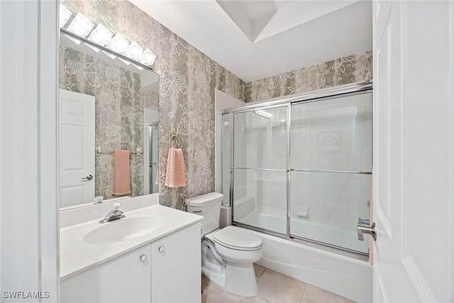 24400 Reserve Ct Unit 103, Bonita Springs, FL 34134 - full bath with vanity, bath / shower combo with glass door, tile patterned floors, and wallpapered walls