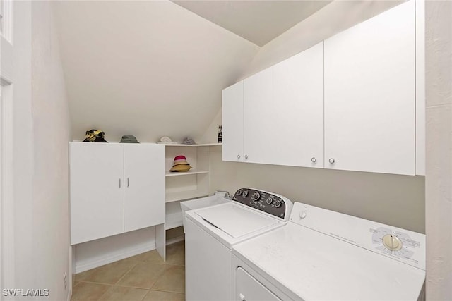24400 Reserve Ct Unit 103, Bonita Springs, FL 34134 - laundry room with cabinet space, washing machine and dryer, and light tile patterned flooring