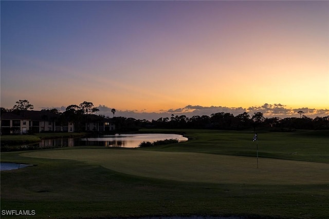 24400 Reserve Ct Unit 103, Bonita Springs, FL 34134 - view of home's community with a water view, view of golf course, an area to practice putting, and a lawn