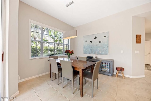 24400 Reserve Ct Unit 103, Bonita Springs, FL 34134 - dining space with light tile patterned floors