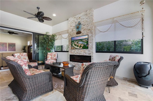 14274 Arrow Point Ct, Estero, FL 33928 - living area with a ceiling fan, stone tile flooring, plenty of natural light, and recessed lighting