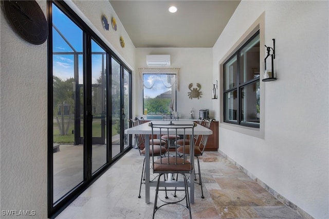 14274 Arrow Point Ct, Estero, FL 33928 - sunroom / solarium featuring a wall unit AC and healthy amount of natural light